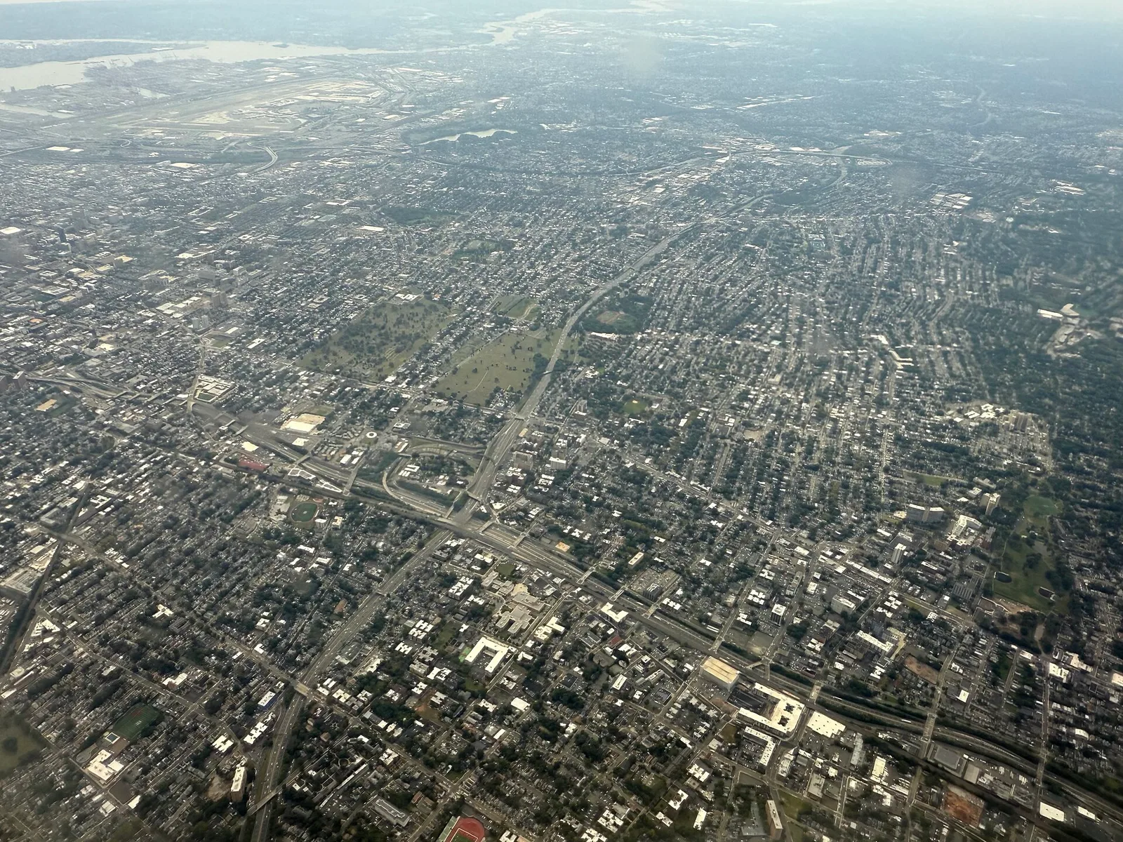 East Orange, New Jersey: 2025-09-12 12 26 42 Aerial view centered on East Orange in Essex County, New Jersey, seen from an aircraft which just departed from Newark Liberty International Airport